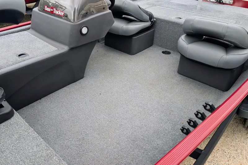 Slide: The Image of 2021 Tracker Bass Tracker Classic XL boat interior with gray carpet and seating. - 6
