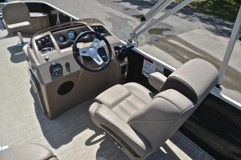 Slide: The Image of 2019 Bennington 22 boat interior with steering wheel and captain's chair. - 26