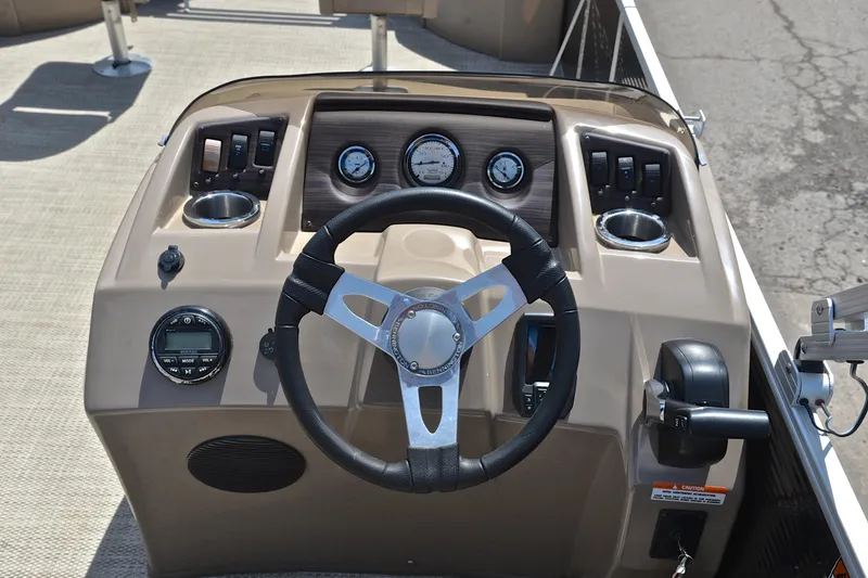 Slide: The Image of 2019 Bennington 22 boat dashboard with steering wheel and control panel. - 27