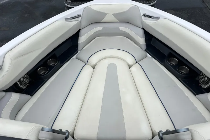 Slide: The Image of Interior seating of a 2014 Malibu Wakesetter 23 LSV boat with cup holders. - 4