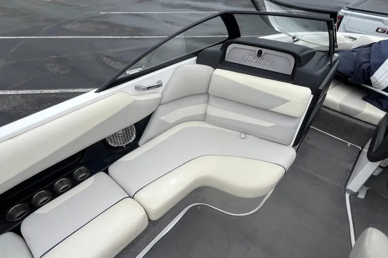 Slide: The Image of Interior of a 2014 Malibu Wakesetter 23 LSV boat with white and gray seating. - 6