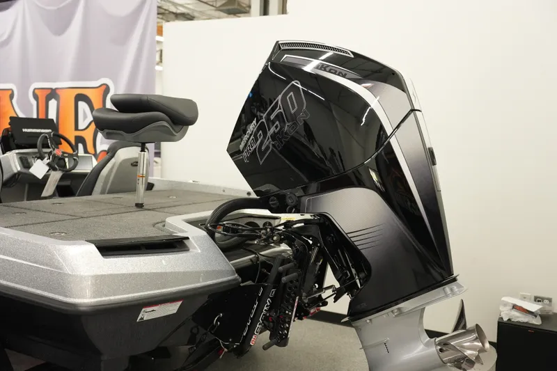 Slide: The Image of 2026 iKon LXE20 boat with powerful outboard motor in showroom display. - 1