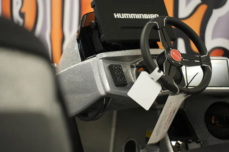 Slide: The Image of Steering wheel and dashboard of 2026 iKon LXE20 boat with Humminbird display. - 10