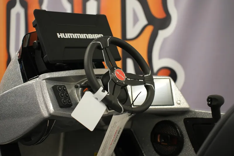 Slide: The Image of Steering wheel and dashboard of 2026 iKon LXE20 boat with Humminbird display. - 11