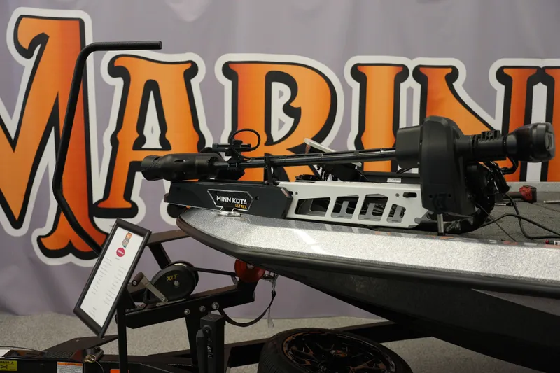 Slide: The Image of 2026 iKon LXE20 boat with Minn Kota Ultrex motor displayed at a marine exhibition. - 18