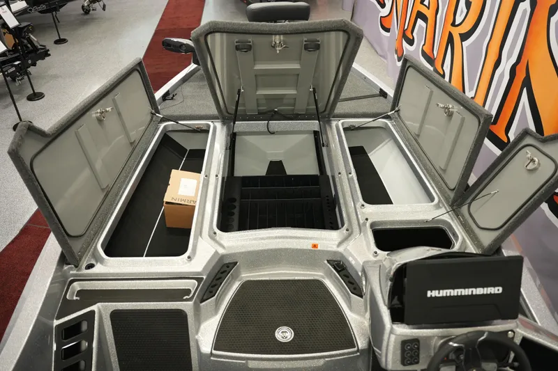 Slide: The Image of Open storage compartments on a 2026 iKon LXE20 boat, featuring Humminbird electronics. - 22
