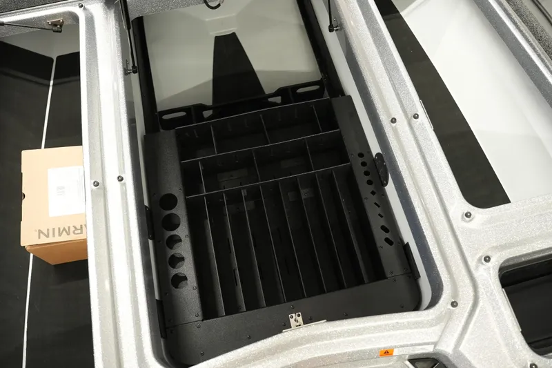 Slide: The Image of Interior view of 2026 iKon LXE20 storage compartment with organized sections and a cardboard box. - 23