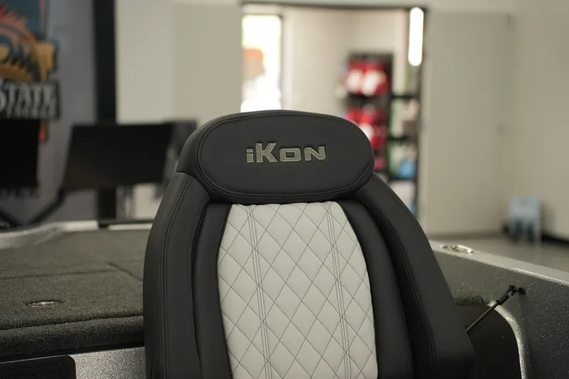 Slide: The Image of iKon LXE20 2026 boat seat with quilted design in showroom setting. - 25