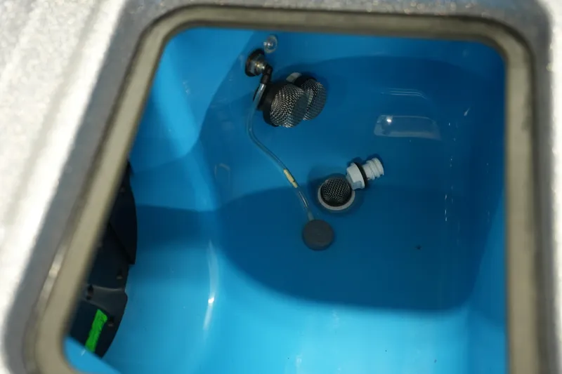 Slide: The Image of Interior view of iKon LXE20 (2026) blue compartment with metal fittings and wiring. - 28