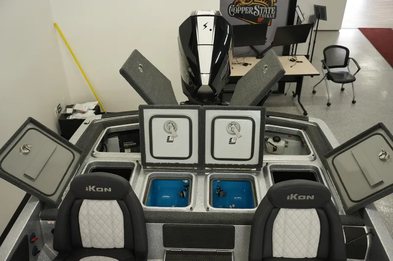 Slide: The Image of 2026 iKon LXE20 boat interior with open storage compartments and seating. - 29