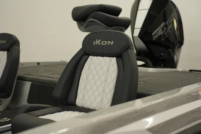Slide: The Image of 2026 iKon LXE20 boat seat with quilted design and sleek black motor. - 6