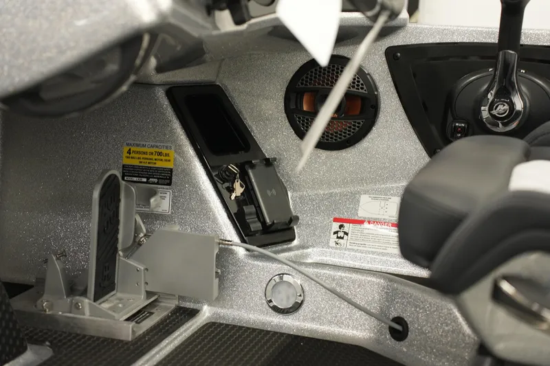 Slide: The Image of Interior of 2026 iKon LXE20 boat showing controls, speaker, and capacity label. - 9