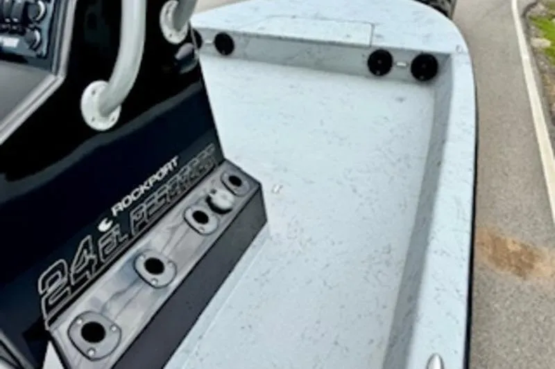 Slide: The Image of 2023 El Pescador 24 CAT boat deck with rod holders and console details. - 12