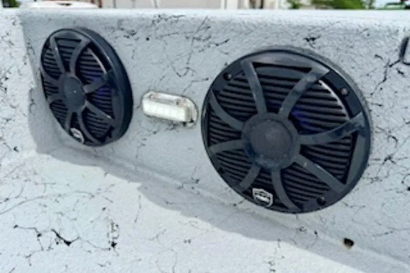 Slide: The Image of Speakers on 2023 El Pescador 24 CAT boat, featuring a textured surface design. - 15