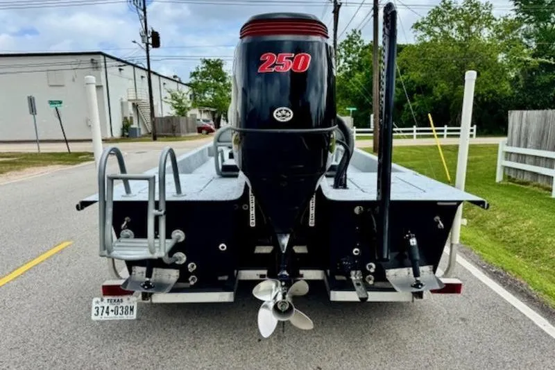 Slide: The Image of 2023 El Pescador 24 CAT boat with powerful 250 HP engine on a street. - 3