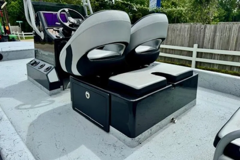 Slide: The Image of 2023 El Pescador 24 CAT boat interior with dual seats and control console. - 8