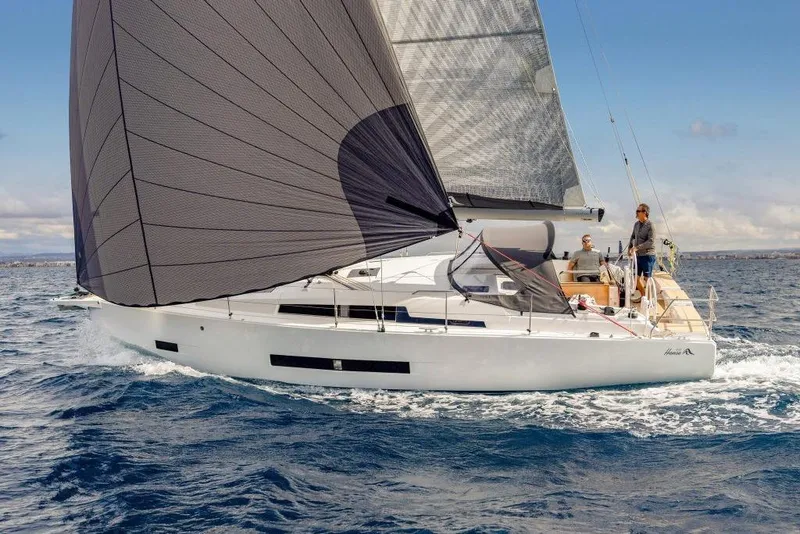 The Image of Hanse 360 sailboat 2026 on open sea with black sail. - 1