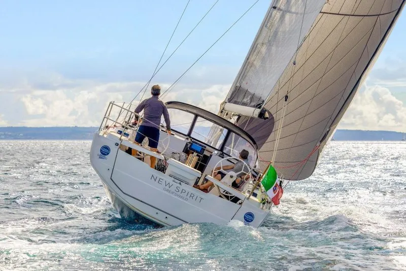 Slide: The Image of Hanse 360 sailboat 2026 on open sea with Italian flag. - 17