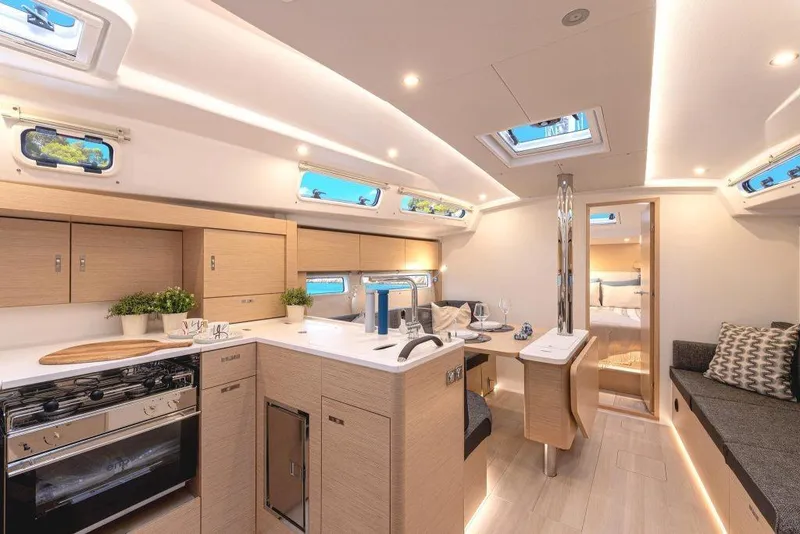 Slide: The Image of Interior of 2026 Hanse 360 yacht with modern kitchen and dining area. - 5