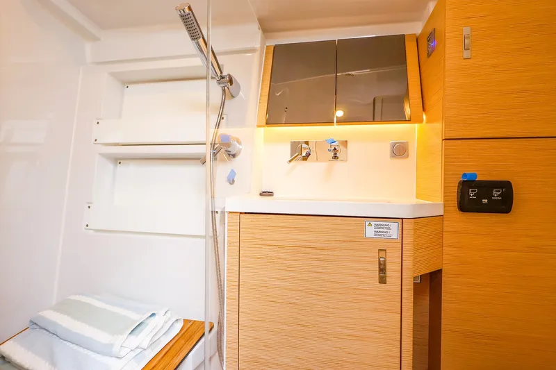 Slide: The Image of Modern bathroom interior of 2026 Hanse 360 yacht with wooden cabinetry and shower. - 8