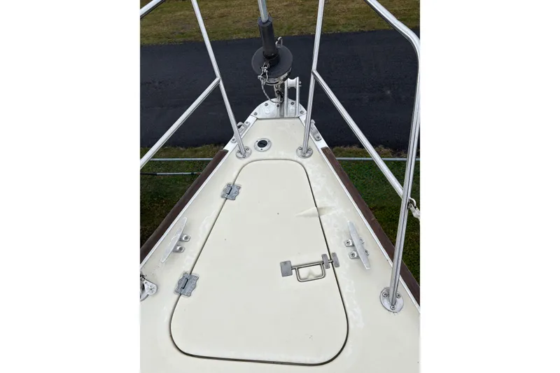 Slide: The Image of Bow of 1988 Pearson 28 sailboat with hatch and stainless steel railing. - 11
