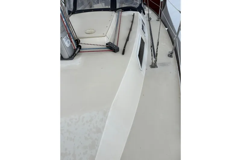 Slide: The Image of Pearson 28 sailboat deck, 1988 model, featuring rigging and safety rails. - 14