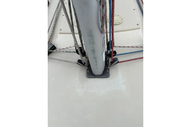 Slide: The Image of Deck view of a 1988 Pearson 28 sailboat mast with rigging and ropes. - 15