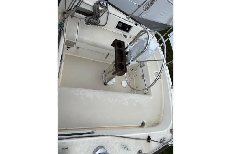 Slide: The Image of Cockpit of a 1988 Pearson 28 sailboat with steering wheel and controls. - 16