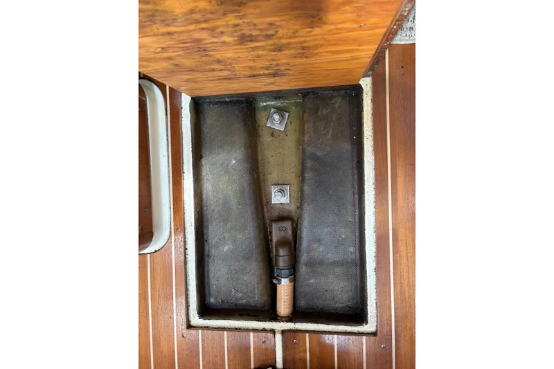 Slide: The Image of Close-up of mechanical components in a 1988 Pearson 28 boat engine compartment. - 44