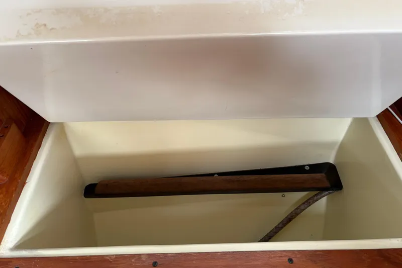 Slide: The Image of Open storage compartment in a 1988 Pearson 28 sailboat interior. - 18