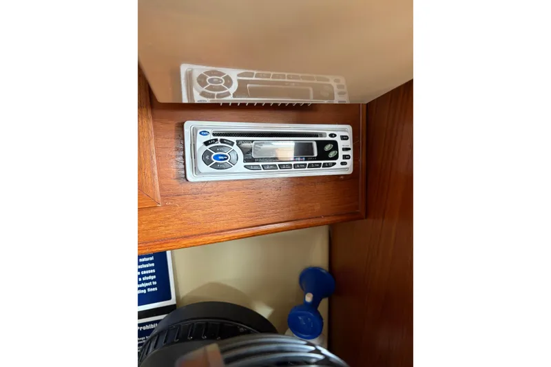 Slide: The Image of Built-in stereo system on a 1988 Pearson 28 sailboat, mounted in wooden cabinetry. - 28
