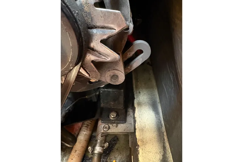 Slide: The Image of Close-up of mechanical components in a 1988 Pearson 28 boat engine compartment. - 39