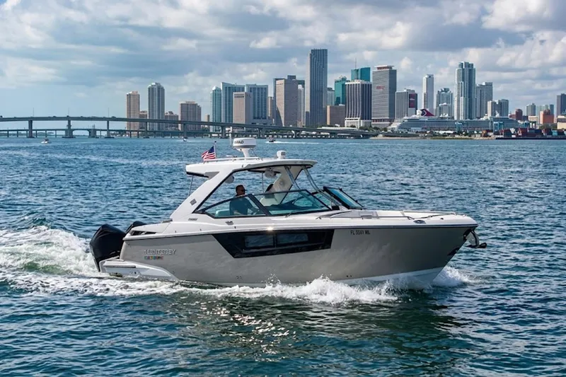 The Image of 2022 Monterey 385SS Super Sport cruising near city skyline on a sunny day. - 1