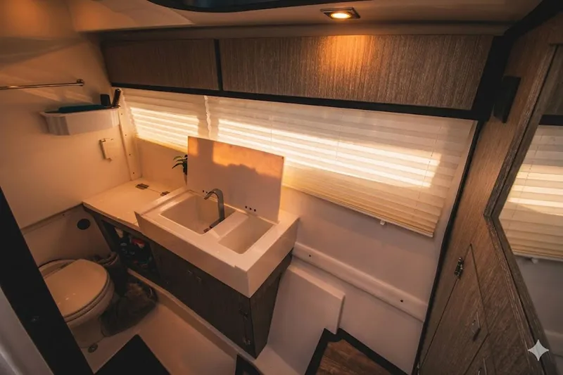 Slide: The Image of Luxurious bathroom interior of 2022 Monterey 385SS Super Sport boat with modern fixtures. - 25