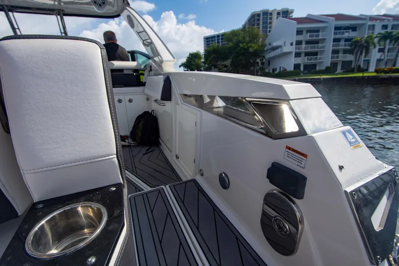 Slide: The Image of 2022 Monterey 385SS Super Sport boat interior with modern seating and waterfront view. - 28