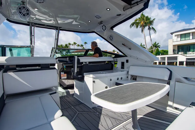 Slide: The Image of 2022 Monterey 385SS Super Sport boat interior with modern seating and table. - 37
