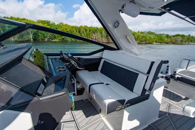 Slide: The Image of 2022 Monterey 385SS Super Sport boat interior with sleek seating and modern dashboard design. - 39