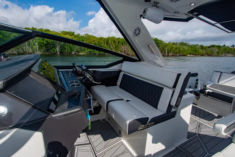 Slide: The Image of 2022 Monterey 385SS Super Sport boat interior with sleek seating and modern dashboard. - 40