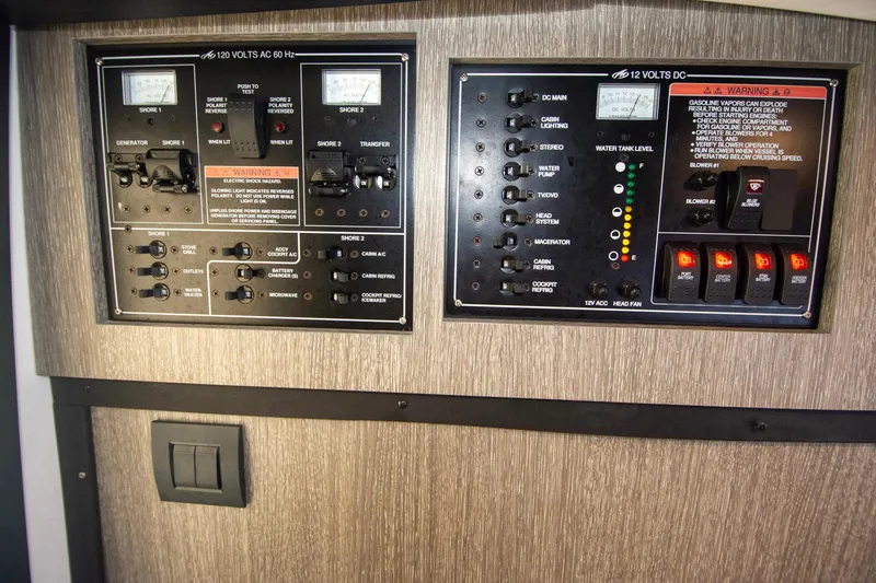 Slide: The Image of Control panel of a 2022 Monterey 385SS Super Sport boat, featuring various switches and indicators. - 42