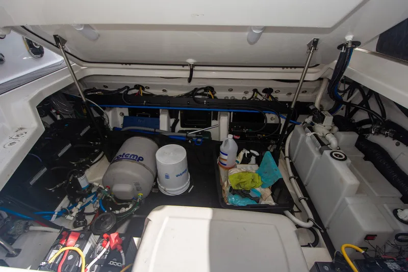 Slide: The Image of Engine compartment of 2022 Monterey 385SS Super Sport boat, showcasing equipment and storage. - 43