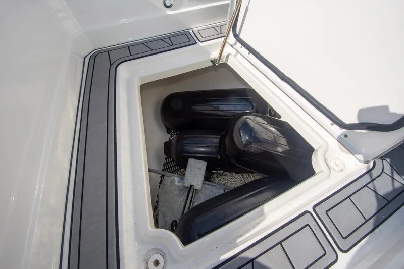 Slide: The Image of Storage compartment on a 2022 Monterey 385SS Super Sport boat, containing fenders and equipment. - 45