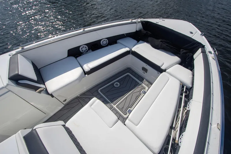 Slide: The Image of 2022 Monterey 385SS Super Sport boat interior with white seating and water view. - 47