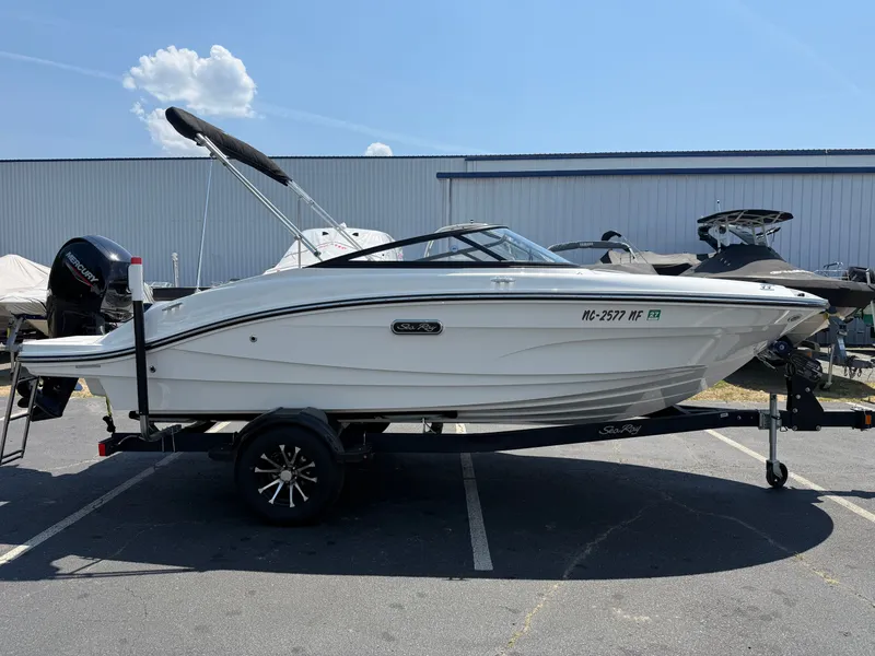 Slide: The Image of 2025 Sea Ray SPX 190 Outboard parked on trailer outdoors. - 1