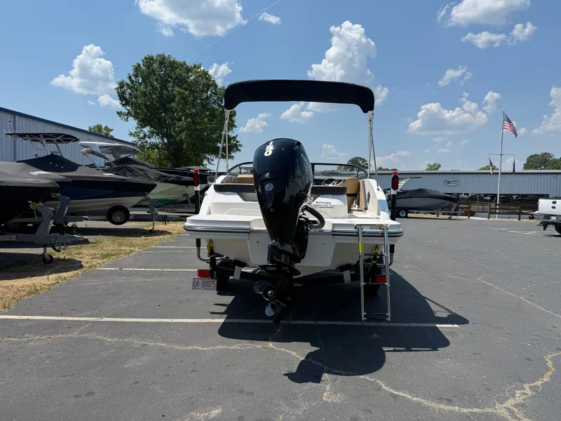 Slide: The Image of 2025 Sea Ray SPX 190 Outboard boat in parking lot under sunny skies. - 3