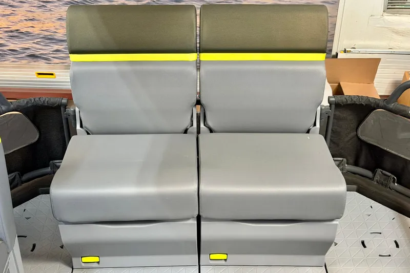 Slide: The Image of 2026 Sea-Doo Switch Fish 21 seating with gray cushions and yellow accents. - 14