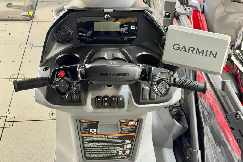 Slide: The Image of 2026 Sea-Doo Switch Fish 21 dashboard with Garmin navigation system and control panel. - 21