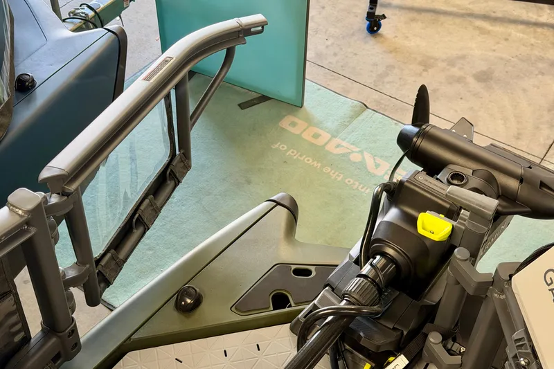 Slide: The Image of 2026 Sea-Doo Switch Fish 21 boat interior, showcasing steering and control features. - 7
