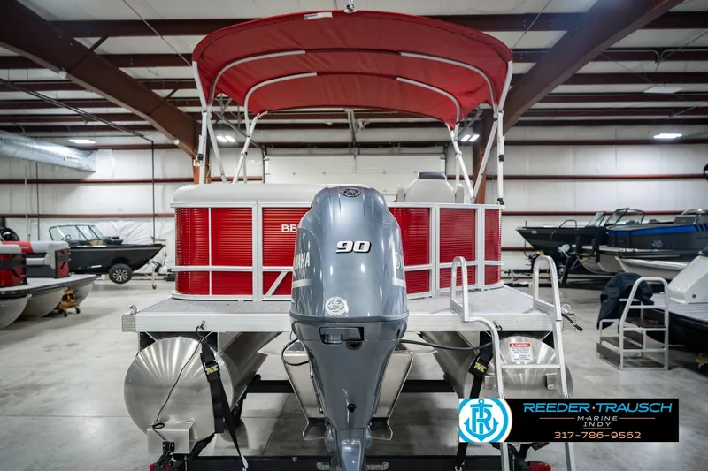 Slide: The Image of 2025 Bennington 20 SLS pontoon boat with Yamaha 90 engine in showroom. - 10