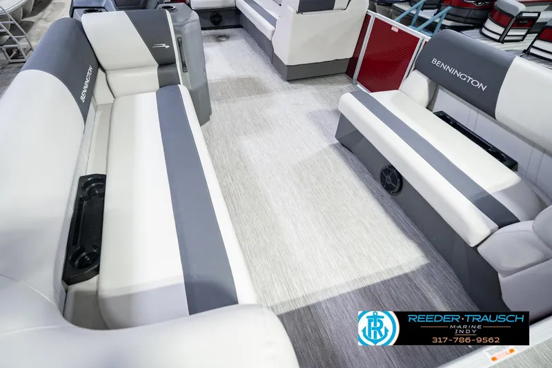 Slide: The Image of Interior of a 2025 Bennington 20 SLS pontoon boat with gray and white seating. - 15