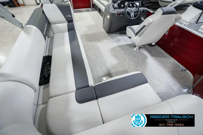 Slide: The Image of 2025 Bennington 20 SLS boat interior with plush seating and modern dashboard. - 18